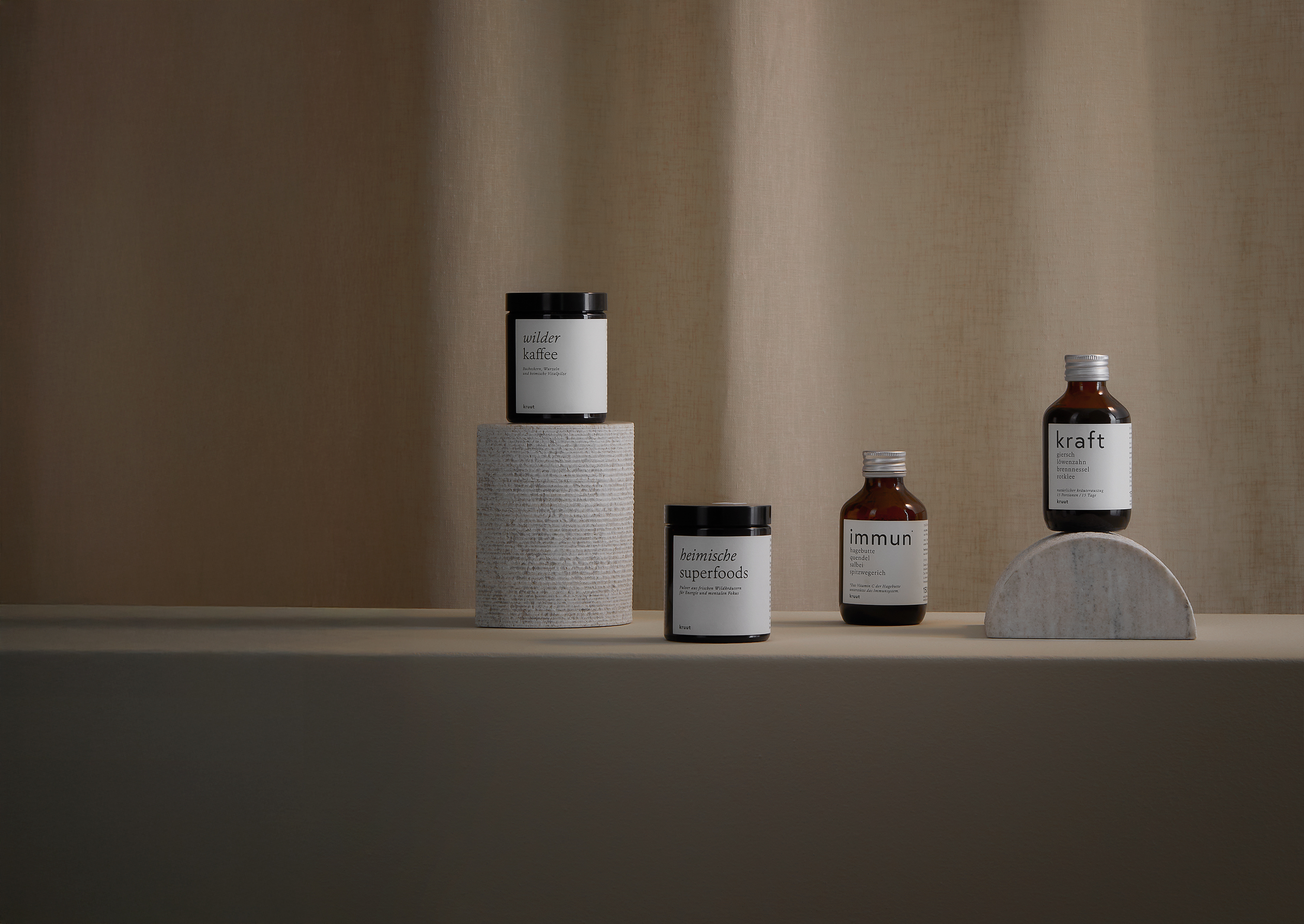 Kruut Product Photography shwoing 5 products in brown glass bottles